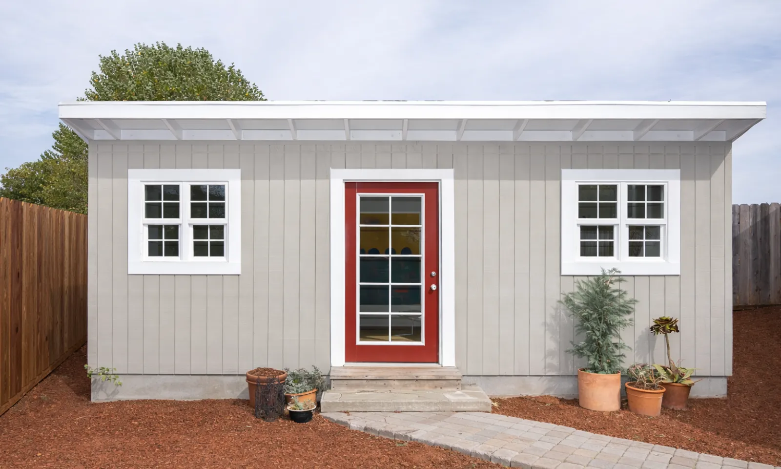 Modern detached ADU guest house built in a Los Angeles backyard featuring stucco exterior finish, energy-efficient windows, and independent residential living space